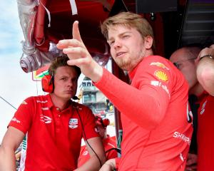 Prema Racing driver Robert Shwartzman looks out from his pit box during a practice for the 109th...